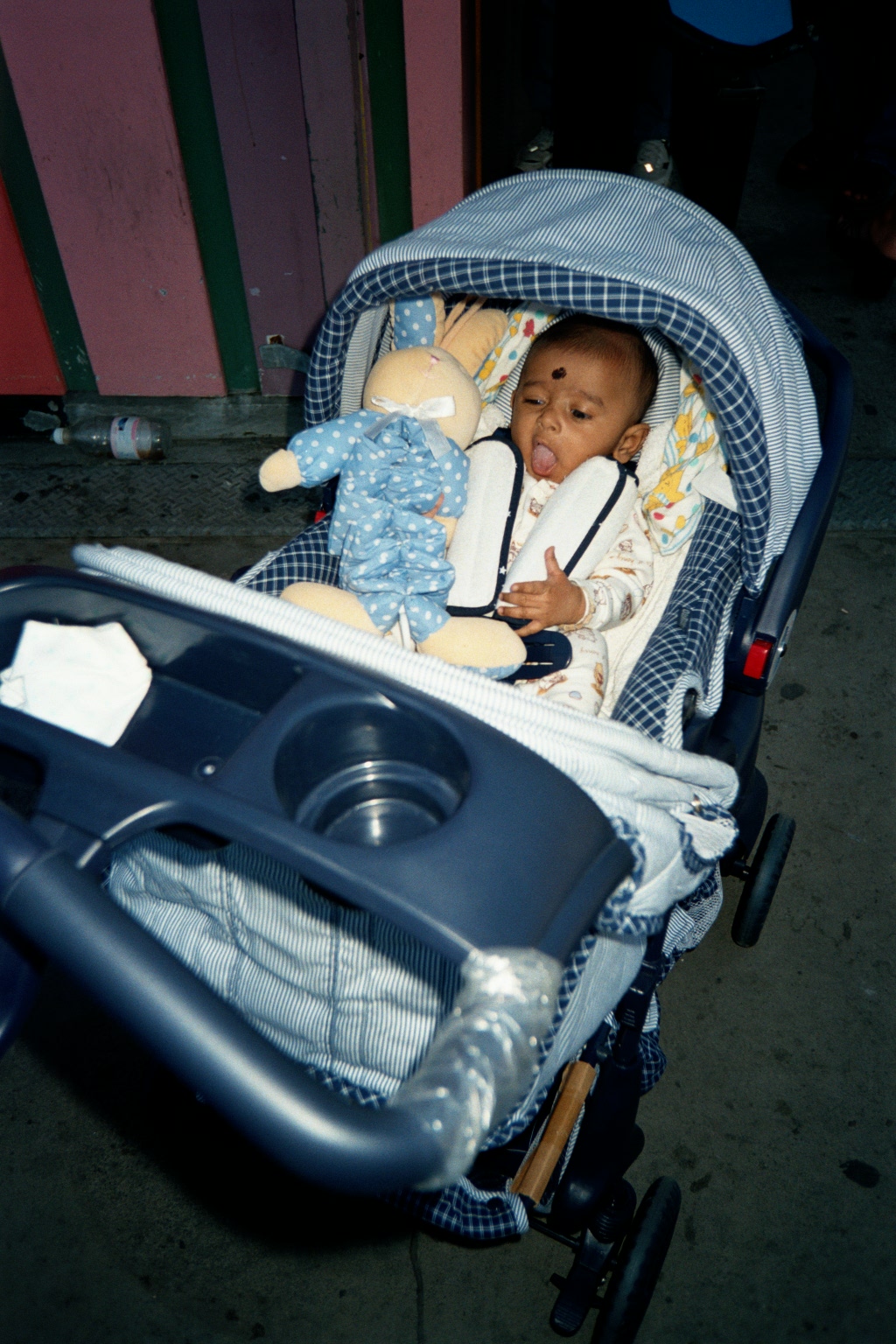 A happy baby under blanket; Actual size=240 pixels wide