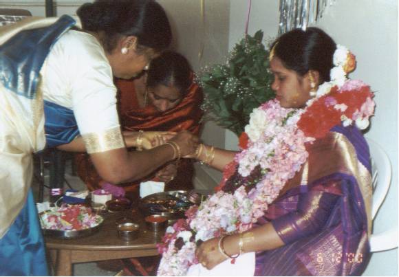 A woman playing with children; Actual size=180 pixels wide